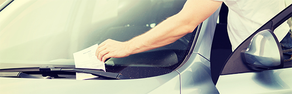 Parking ticket under windshield wiper