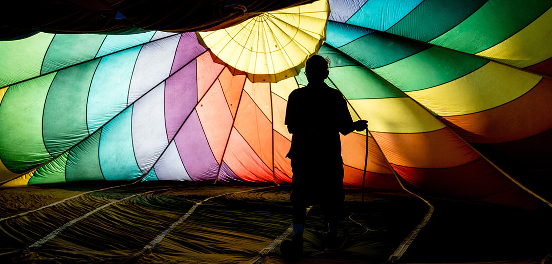 Man inflating a hot air balloon 