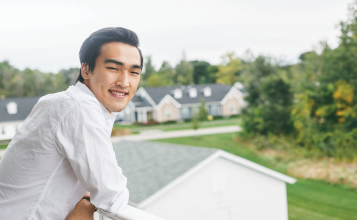 Man stands on balcony