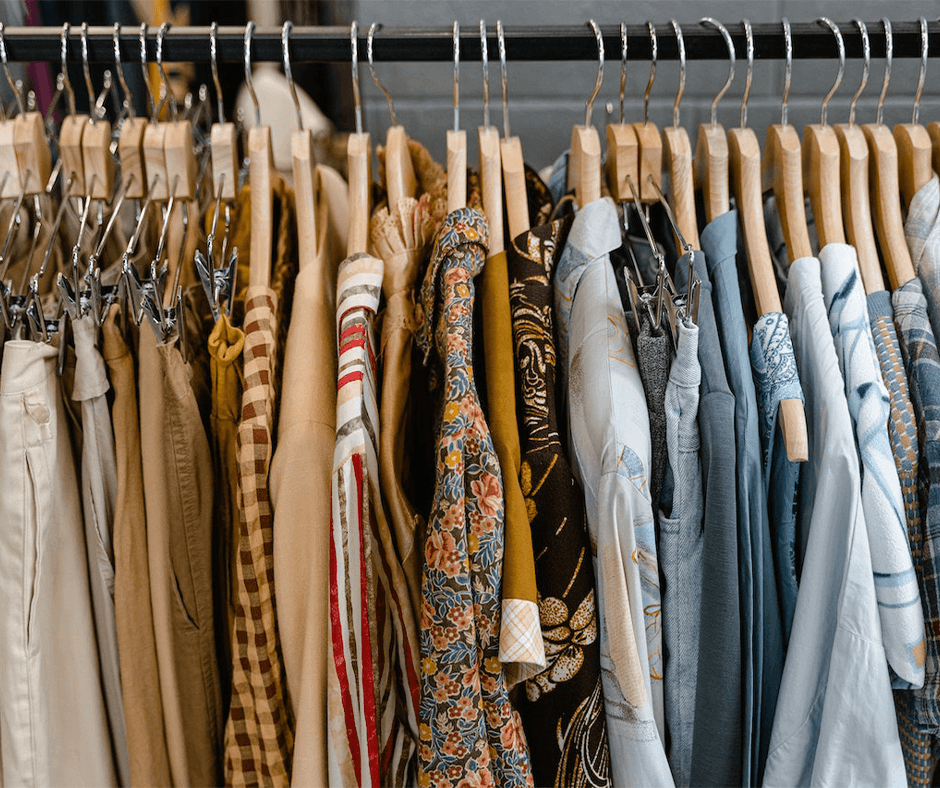 Assorted clothes hanging in a closet. Image credit: Mart Productions