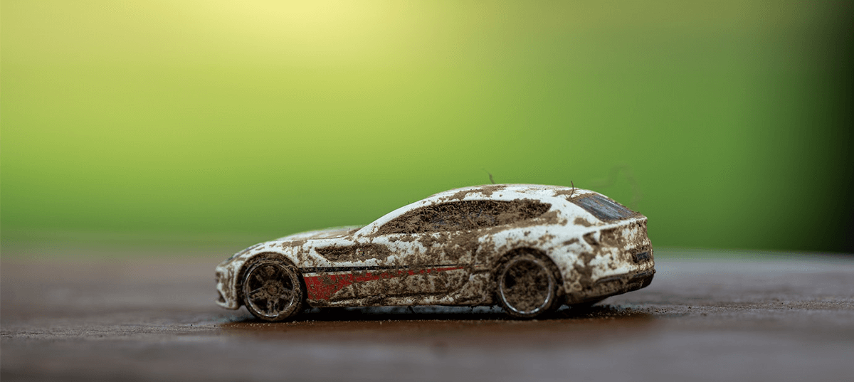 Toy car covered in mud. Image credit: Chris F