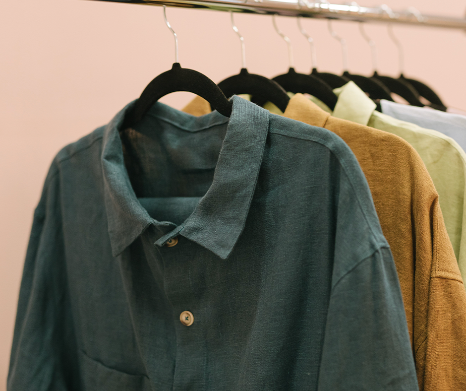Thin shirts hanging on slim hangers in a closet. Image credit: Thirdman.