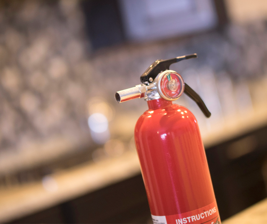 Fire extinguisher in a kitchen.