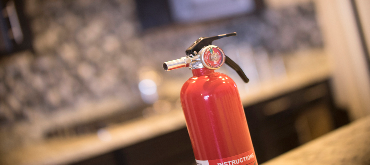 Fire extinguisher in a kitchen.