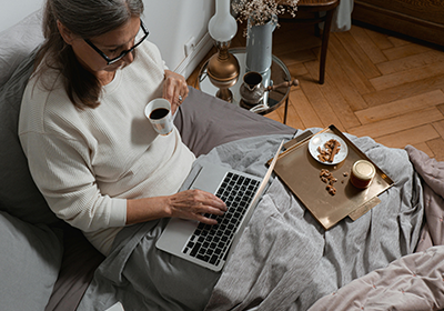 Woman typing on a laptop